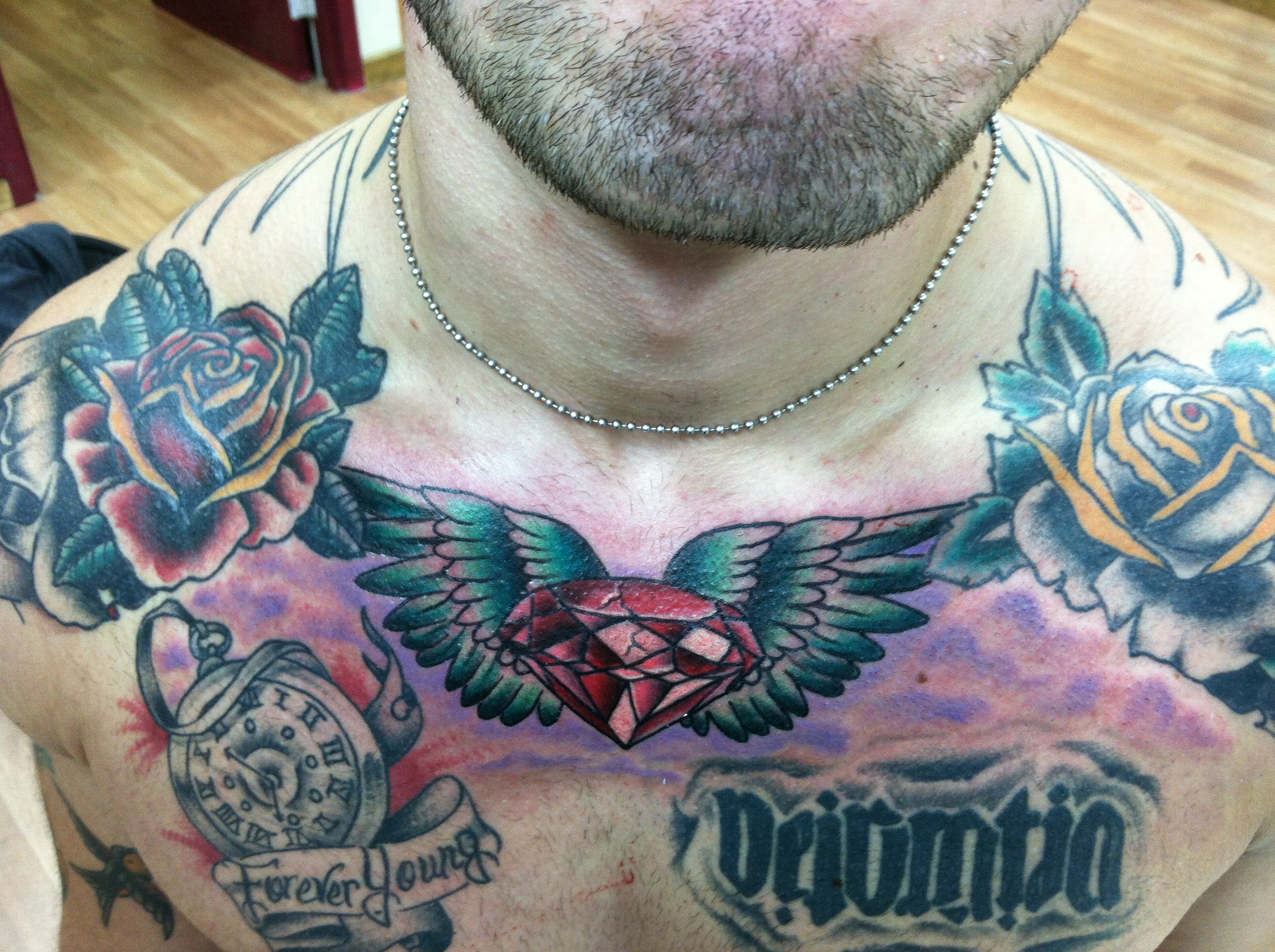 Cherry blossoms as filler on Jakes chest 